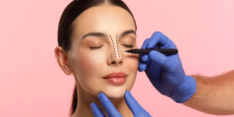 Close-up view of a gentle facial massage focusing on the nose and surrounding areas